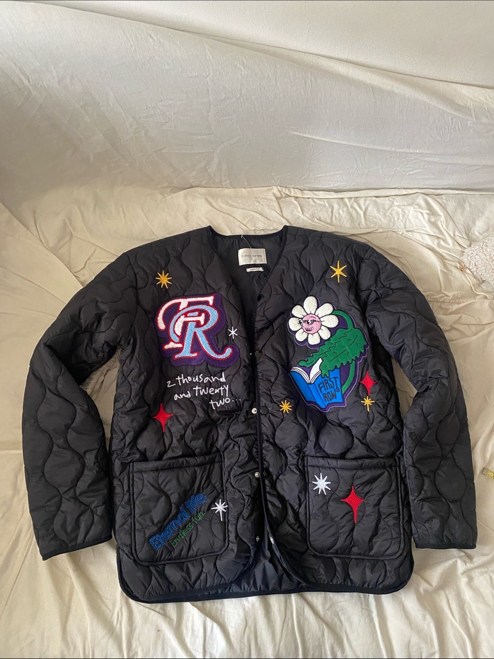 Black Quilted Bomber Jacket with Embroidered Patch Details